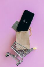 Black Smartphone on Brown Paper Bag